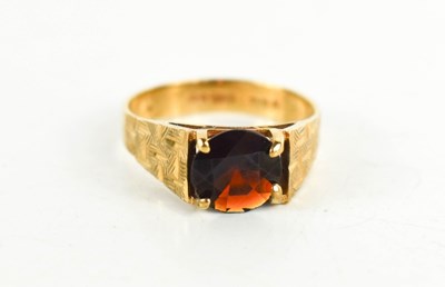 Lot 59 - A 9ct gold and garnet ring, of modernist...