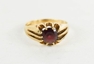 Lot 73 - A 9ct gold and garnet dress ring, the...