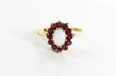 Lot 93 - A 9ct gold, opal and garnet cluster ring, the...