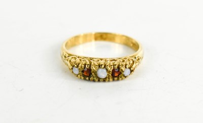 Lot 76 - A 9ct gold, opal and garnet five stone ring,...