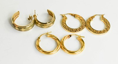 Lot 154 - Three pairs of 9ct gold hoop earrings, to...