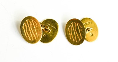 Lot 247 - A pair of 18ct gold oval cufflinks engraved...