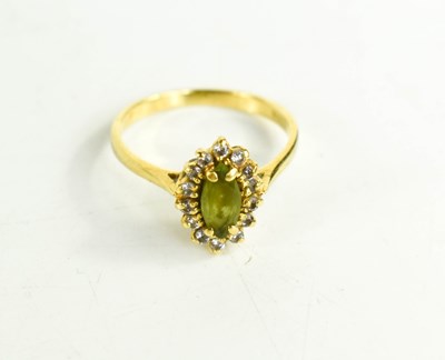 Lot 72 - An 18ct gold, diamond and peridot ring, the...