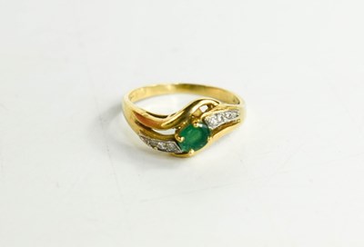 Lot 153 - An 18ct gold, emerald and diamond ring, marked...