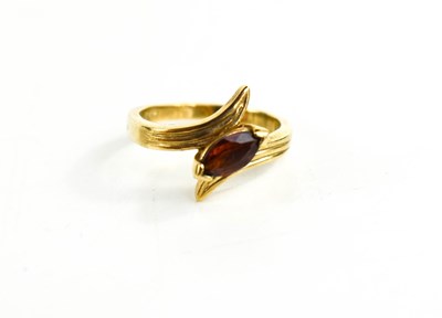 Lot 116 - A 9ct gold and garnet ring, the marquise cut...