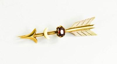 Lot 180 - A 14ct gold and garnet set brooch in the form...