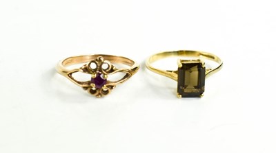 Lot 68 - A 9ct gold dress ring set with an emerald cut...