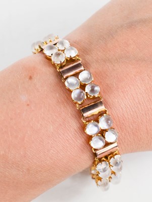 Lot 1 - A 9ct rose gold and moonstone bracelet, likely...