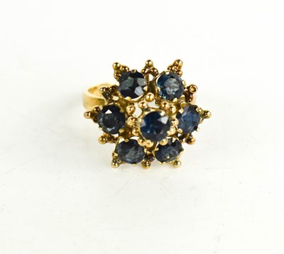 Lot 16 - An 18ct gold and sapphire cluster ring, of mid...