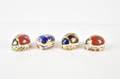 Lot 107 - A group of three Royal Crown Derby ladybird...