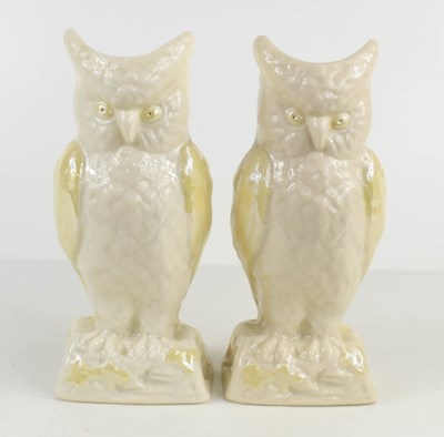 Lot 83 - A pair of Belleek owl vases with pale yellow...