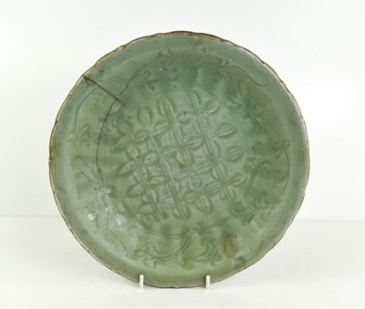 Lot 252 - A 'Longquan' celadon charger, with diaper and...