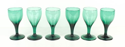 Lot 193 - A set of six 19th century green wine glasses,...