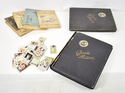 Lot 205 - A group of cigarette cards, some in albums and...