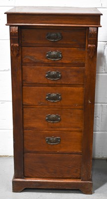 Lot 456 - An early 20th century oak Wellington type...