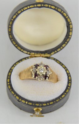 Lot 137 - A 9ct gold ring in the form of a flower and...