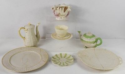 Lot 97 - A Belleek teapot of organic shell form with...