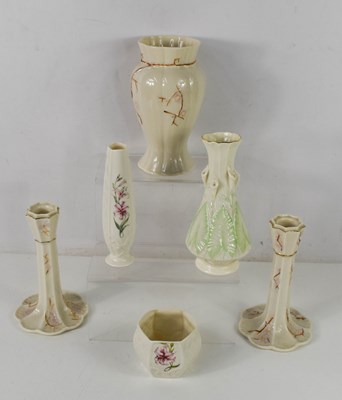 Lot 98 - A pair of Belleek porcelain candlesticks...