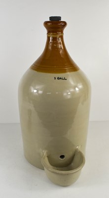 Lot 174 - A vintage stoneware one gallon chicken feeder.