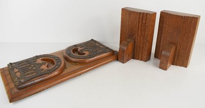 Lot 300 - An Arts and Crafts sliding book stand, with...