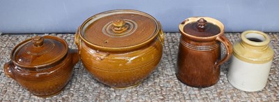 Lot 124 - A large treacle glazed stoneware casserole or...