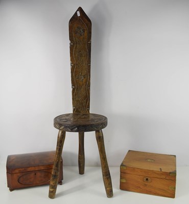 Lot 303 - A three legged spinning stool with carved high...