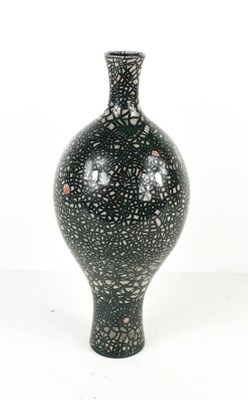 Lot 74 - A studio pottery bottle vase, with black over...