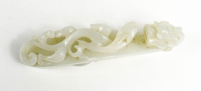 Lot 4 - A Chinese 19th century jade button / belt hook,...