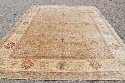 Lot 454 - A large Zeigler rug, with a cream ground,...