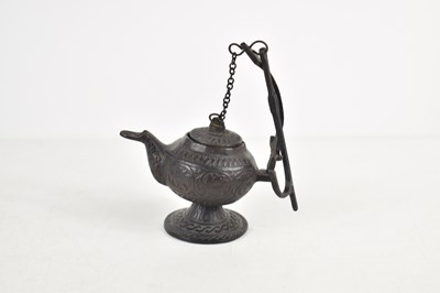 Lot 285 - A bronze oil burner, with hanger in the Roman...