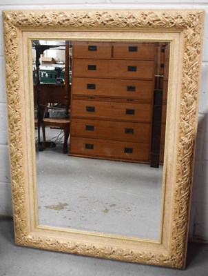 Lot 437 - A large overmantle mirror, with bevelled glass,...