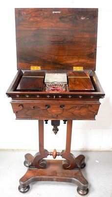 Lot 493 - A 19th century rosewood teapoy, the lid opens...