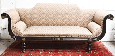 Lot 494 - A Regency settee, the frame carved with reeded...