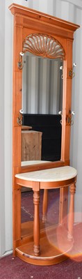 Lot 472 - A mirror backed hall stand, with hooks to...