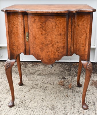 Lot 450 - A George III walnut bow fronted pot cupboard...