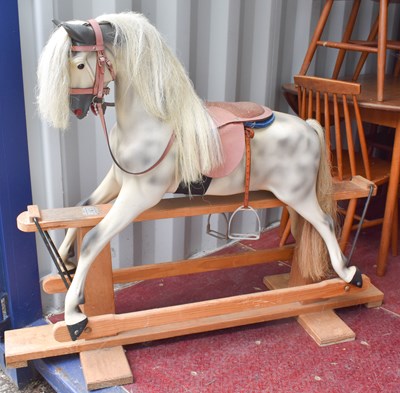 Lot 383 - A dapple grey Haddon Rocking Horse on stand,...