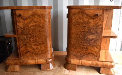 Lot 485 - A pair of Art Deco walnut veneer bedside...