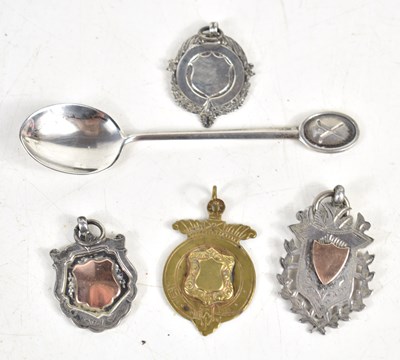 Lot 185 - A silver golf spoon together with three silver...