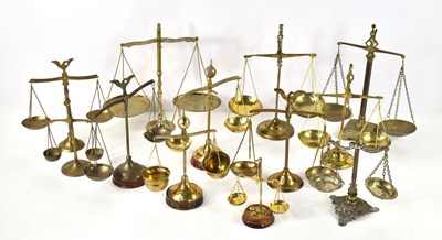 Lot 188 - A collection of brass balance scales of...