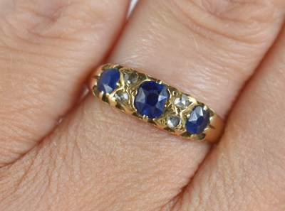 Lot 168 - An 18ct gold, sapphire and diamond ring, set...