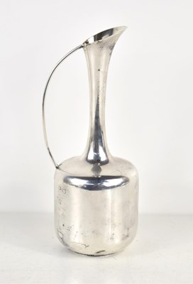 Lot 322 - A vintage Danish white metal jug, the base...