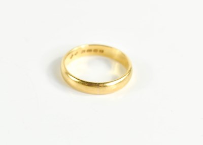 Lot 64 - A 22ct gold wedding band, size L, 3.8g.