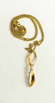 Lot 190 - An 18ct gold infinity pendant and fine chain,...