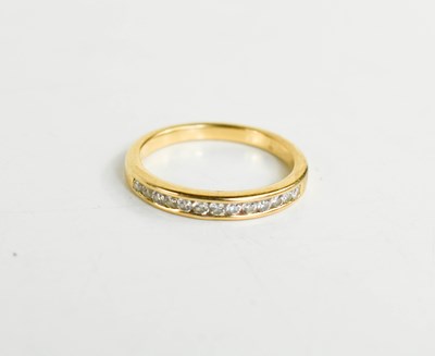 Lot 166 - An 18ct gold half eternity ring, set with...