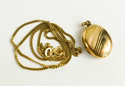 Lot 246 - A 9ct gold chain with locket having gold front...