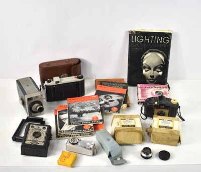 Lot 335 - A group of cameras and photography related...