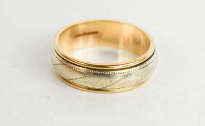 Lot 147 - A 9ct gold wedding band, with swivel white...