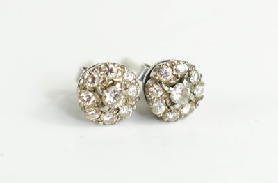 Lot 90 - A pair of diamond flowerhead earrings, each...