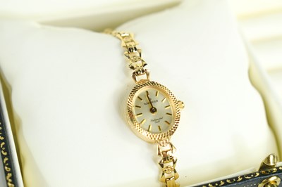 Lot 256 - A 9ct gold Sovereign cocktail watch the signed...