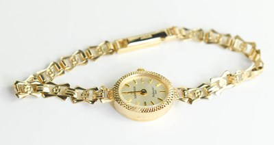 Lot 256 - A 9ct gold Sovereign cocktail watch the signed...